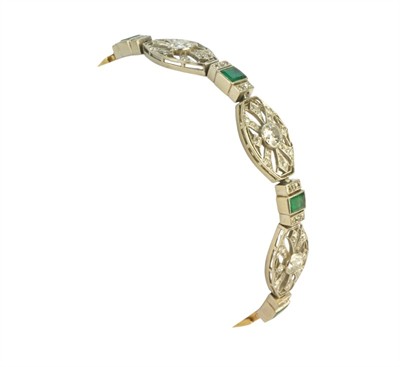 Platninovo-zlatý náramek s brilianty a smaragdy