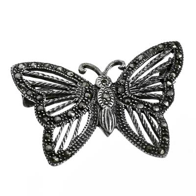 Stříbrná brož s markazity