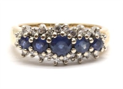 Zlatý prsten s diamanty a safíry