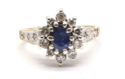 Zlatý prsten s diamanty a safírem