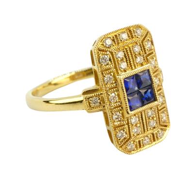 Zlatý prsten s diamanty a modrými safíry