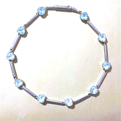 Zlatý náramek s modrými kameny - srdíčka