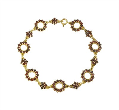 Stříbrný náramek s granáty