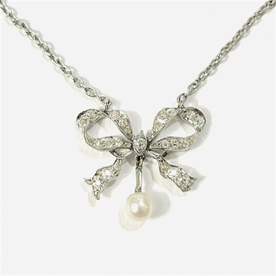 Zlato-platinový secesní koliér "mašle" s diamanty a perlou