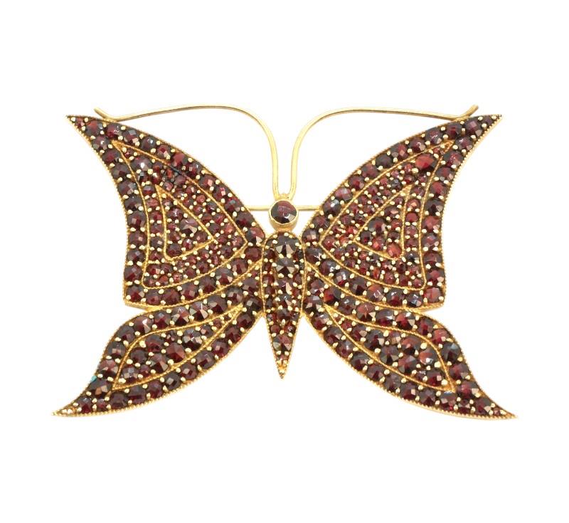 Monumentální motýl s granáty