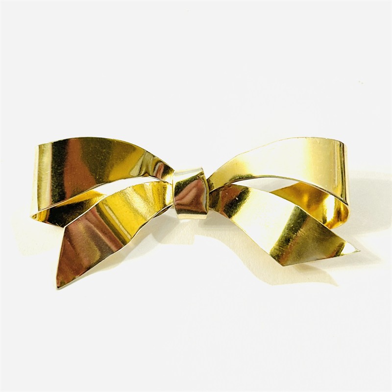 Stříbrná art-deco brož "mašle"