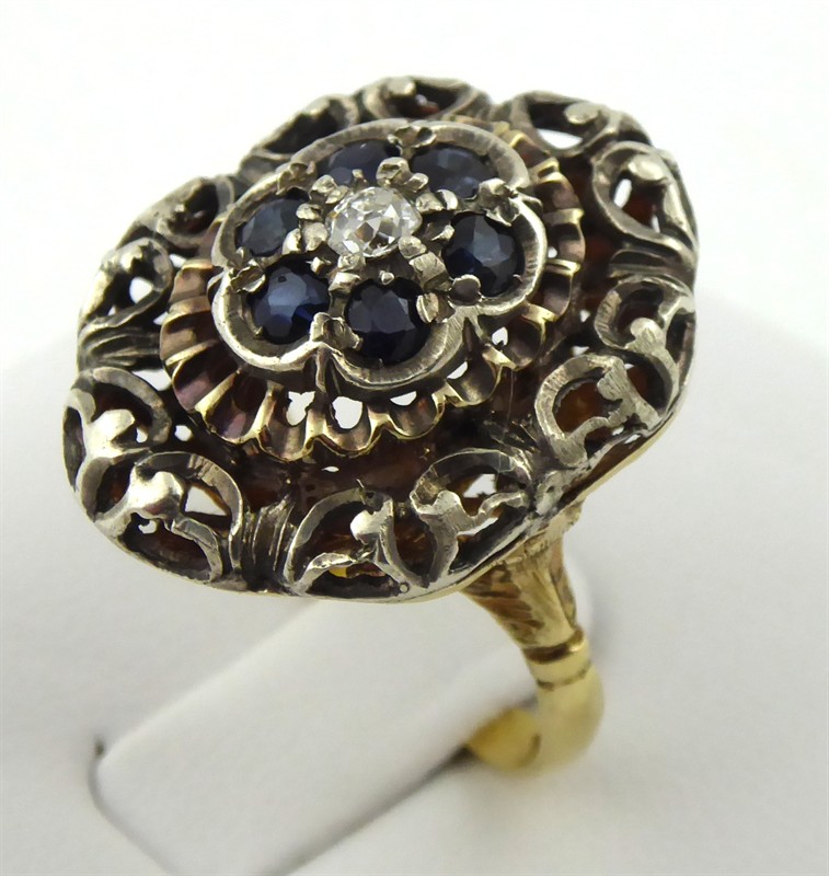 Výrazný prsten s diamantem 0,15 ct a 6 safíry