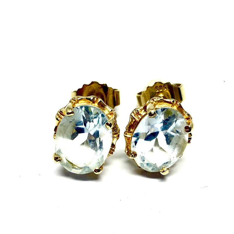 Zlaté náušnice s modrým topazem