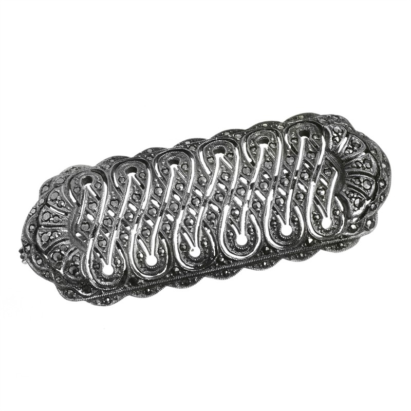 Stříbrná brož s markazity