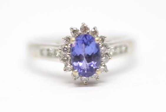 Zlatý prsten s diamanty a tanzanitem