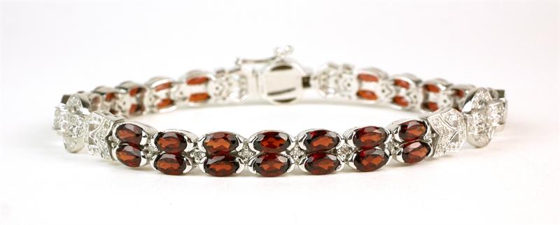 Zlatý náramek s brilianty a granáty