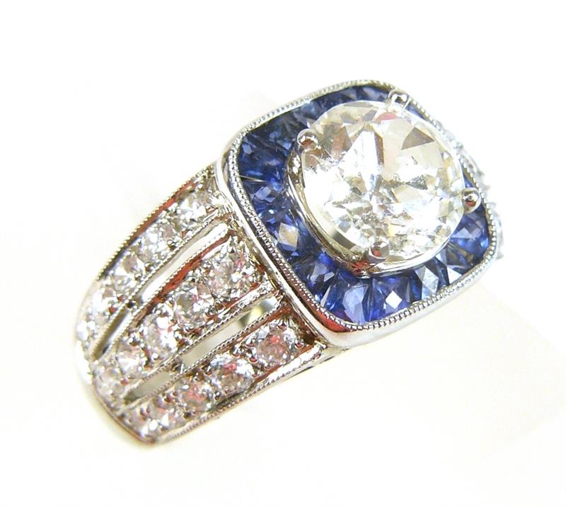 Platinový prsten s brilianty a safíry