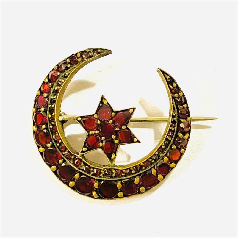 Starožitná brož "srpek měsíce s hvězdou" s českými granáty